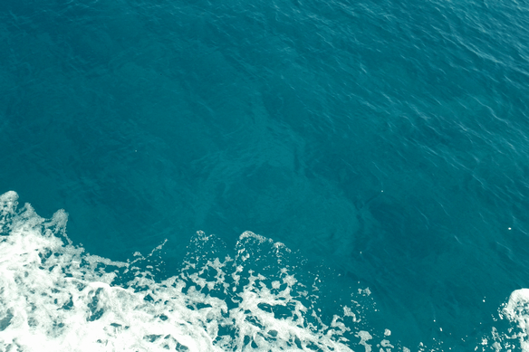 Sea foam against a boat