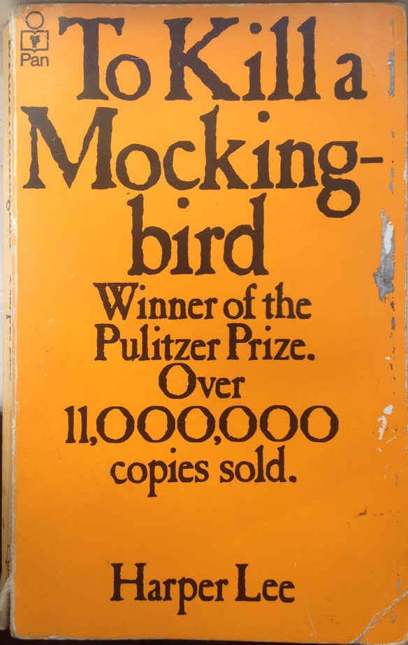 Orange cover of paperback edition of To Kill A Mockingbird
